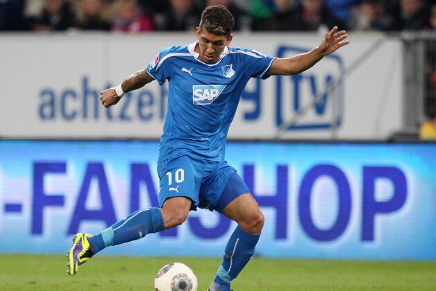 Hoffenheim's Roberto Firmino of Brazil kicks  the ball during a German first division Bundesliga soccer match between TSG 1899 Hoffenheim and Bayern Munich in Sinsheim, Germany, Saturday, Nov.2, 2013. (AP Photo/Michael Probst)