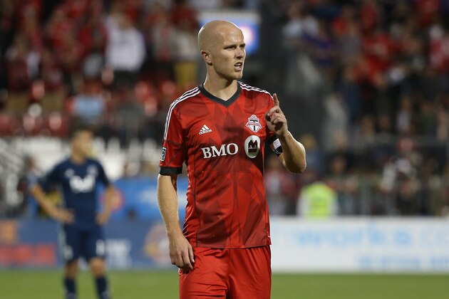 Jul 16, 2014; Toronto, Ontario, CAN; Toronto FC midfielder Michael Bradley (4) during their match against the Vancouver Whitecaps at BMO Field. The FC tied the Whitecaps 1-1. Mandatory Credit: Tom Szczerbowski-USA TODAY Sports