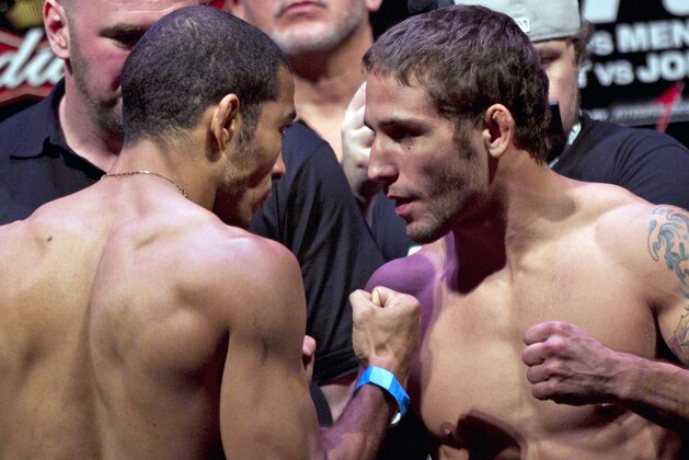 Mixed Martial Arts, MMA, fighters Chad Mendes, from the US, right, and Jose Aldo, from Brazil, gesture for pictures at the weigh-in event ahead of the Ultimate Fighting Championship, UFC, 142 in Rio de Janeiro, Brazil, Friday, Jan. 13, 2012. Aldo and Mendes will fight Friday for the UFC featherweight title. (AP Photo/Felipe Dana)