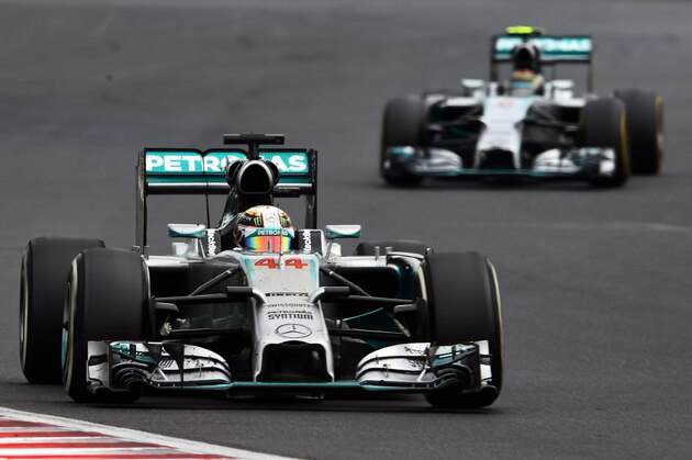 BUDAPEST, HUNGARY - JULY 27:  Lewis Hamilton of Great Britain and Mercedes GP leads Nico Rosberg of Germany and Mercedes GP during the Hungarian Formula One Grand Prix at Hungaroring on July 27, 2014 in Budapest, Hungary.  (Photo by Lars Baron/Getty Images)