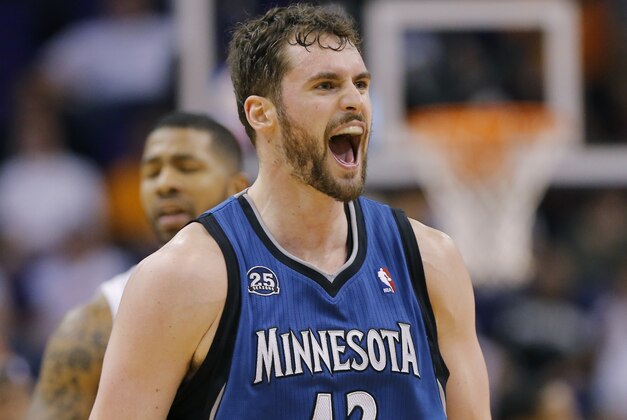 Minnesota Timberwolves forward Kevin Love (42) yells after hitting a three pointer against the Phoenix Suns during the second half of an NBA basketball game, Tuesday, Feb. 25, 2014, in Phoenix. (AP Photo/Matt York)