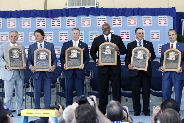 National Baseball Hall of Fame inductees, from left,  Bobby Cox, Tony La Russa, Tom Glavine, Frank Thomas, Greg Maddux and Joe Torre hold their plaques after an induction ceremony at the Clark Sports Center on Sunday, July 27, 2014, in Cooperstown, N.Y. (AP Photo/Mike Groll)