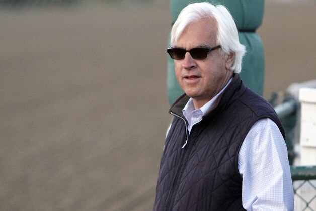 Hall of Fame trainer Bob Baffert watches his Preakness Stakes entrant, Bayern gallop at Pimlico Race Course in Baltimore, Saturday, May 17, 2014.  (AP Photo/Garry Jones)
