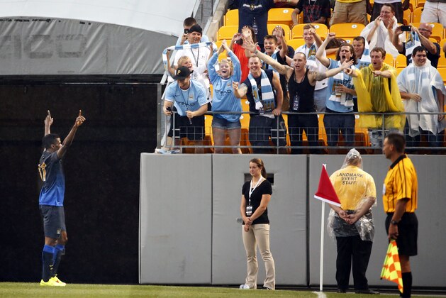 Manchester City forward Kelechi Ihenacho, left, celebrates his goal during the first half of a soccer match in the first round of the Guinness International Champions Cup, at Heinz Field on Sunday, July 27, 2014, in Pittsburgh. (AP Photo/Gene J. Puskar)