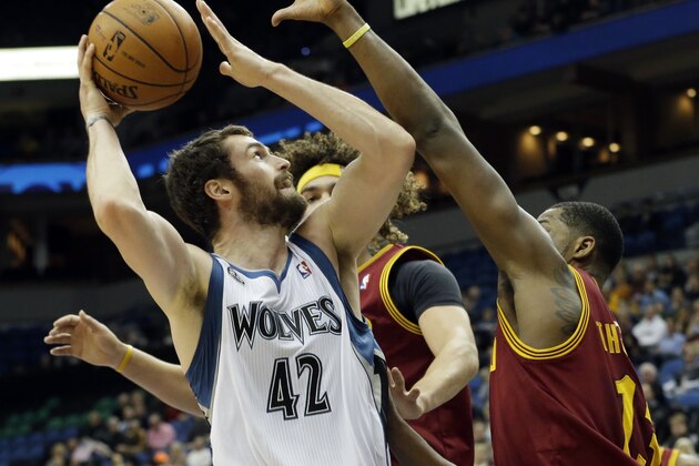 Minnesota Timberwolves' Kevin Love , left, looks to shoot as Cleveland Cavaliers' Tristan Thompson, right, defends in the first quarter of an NBA basketball game, Wednesday, Nov. 13, 2013, in Minneapolis. (AP Photo/Jim Mone)