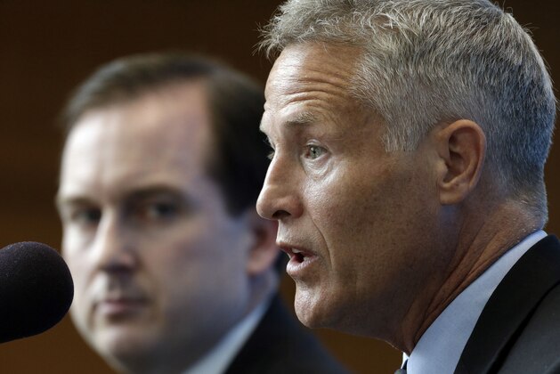 The Philadelphia 76ers' new coach, Brett Brown, right, accompanied by general manager Sam Hinkie, speaks during a news conference Wednesday, Aug. 14, 2013, in Philadelphia. Brown's hiring ended a four-month search to replace Doug Collins. (AP Photo/Matt Rourke)