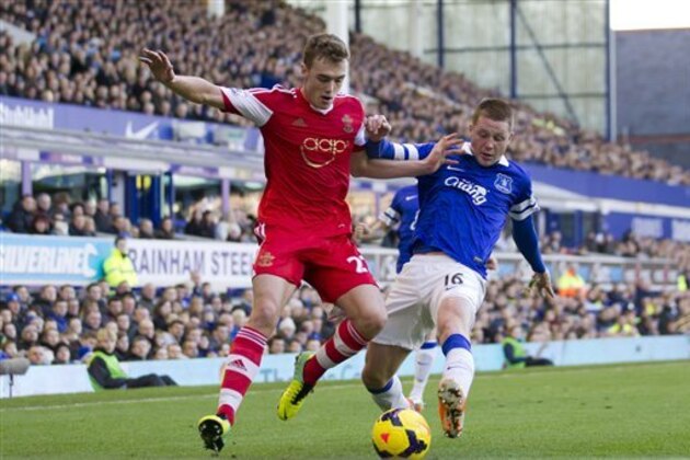 Everton's James McCarthy, right, fights for the ball against Southampton's Calum Chambers during their English Premier League soccer match at Goodison Park Stadium, Liverpool, England, Sunday Dec. 29, 2013. (AP Photo/Jon Super)