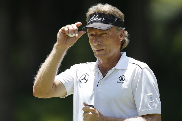 Bernhard Langer tips his visor on the third green during the final round of the 2014 U.S. Senior Open golf tournament at Oak Tree National in Edmond, Okla., Sunday, July 13, 2014. (AP Photo/Sue Ogrocki) Bernhard Langer tips his visor on the third green during the final round of the 2014 U.S. Senior Open golf tournament at Oak Tree National in Edmond, Okla., Sunday, July 13, 2014. (AP Photo/Sue Ogrocki)