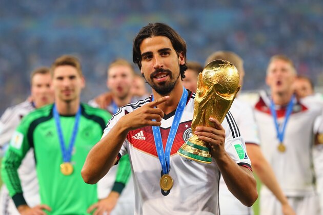 RIO DE JANEIRO, BRAZIL - JULY 13:  Sami Khedira of Germany celebrates with the World Cup trophy after defeating Argentina 1-0 in extra time during the 2014 FIFA World Cup Brazil Final match between Germany and Argentina at Maracana on July 13, 2014 in Rio de Janeiro, Brazil.  (Photo by Martin Rose/Getty Images)