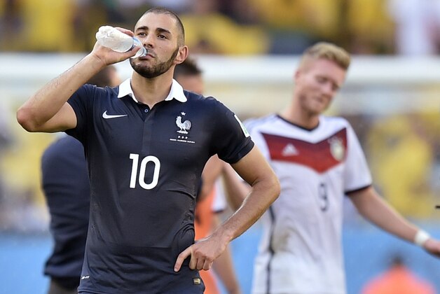 France's Karim Benzema takes a drink at the end of  the World Cup quarterfinal soccer match between Germany and France at the Maracana Stadium in Rio de Janeiro, Brazil, Friday, July 4, 2014. Germany won the match 1-0.  (AP Photo/Martin Meissner)