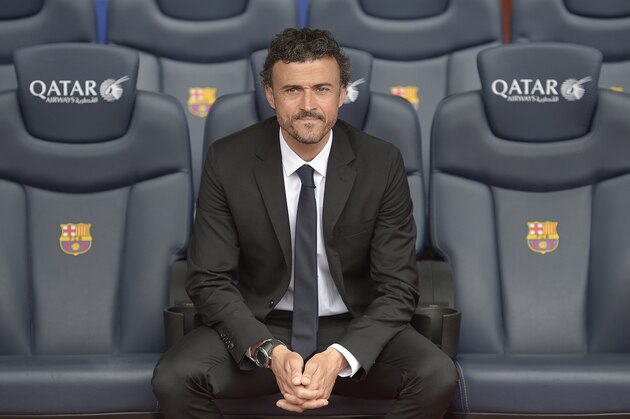Luis Enrique looks on from the bench during his official presentation as new coach of FC Barcelona at the Camp Nou stadium in Barcelona, Spain, Wednesday, May 21, 2014. Former Barcelona player Luis Enrique signed a two-year contract to become coach on Wednesday, a hire the club hopes will resemble the success stories of Johan Cruyff and Pep Guardiola. (AP Photo/Manu Fernandez)