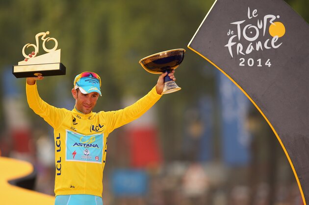 PARIS, FRANCE - JULY 27:  Vincenzo Nibali of Italy and Astana Pro Team celebrates victory in the yellow jersey on the podium following the twenty first stage of the 2014 Tour de France, a 138km stage from Evry into the Champs-Elysees, on July 27, 2014 in Paris, France.  (Photo by Bryn Lennon/Getty Images)