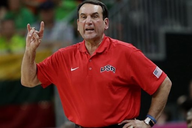 FILE - In this Aug. 4, 2012, file photo, United States coach Mike Krzyzewski signals to players during a preliminary men's basketball game against Lithuania at the 2012 Summer Olympics in London. Krzyzewski begins a new four-year run in earnest with a four-day camp in Las Vegas starting Monday, July 22, 2013.  (AP Photo/Eric Gay, File)