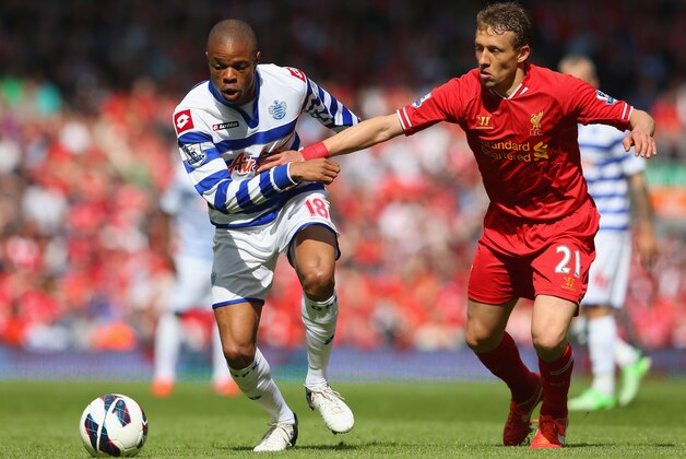 LIVERPOOL, ENGLAND - MAY 19:  Loic Remy of Queens Park Rangers competes with Lucas of Liverpool during the Barclays Premier League match between Liverpool and Queens Park Rangers at Anfield on May 19, 2013 in Liverpool, England.  (Photo by Julian Finney/Getty Images)