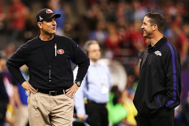 NEW ORLEANS, LA - FEBRUARY 03:  (L-R) Head coach Jim Harbaugh of the San Francisco 49ers and head coach John Harbaugh of the Baltimore Ravens talk on the field during Super Bowl XLVII at the Mercedes-Benz Superdome on February 3, 2013 in New Orleans, Louisiana.  (Photo by Christian Petersen/Getty Images)