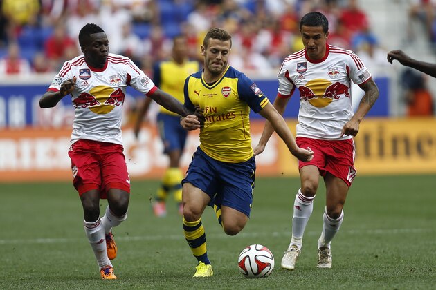 HARRISON, NJ - JULY 26: Jack Wilshere #10 of Arsenal fights for the ball with Ambroise Oyongo #3 and Tim Cahill #17 of New York Red Bulls during their friendly match at Red Bull Arena on July 26, 2014 in Harrison, NJ. (Photo by Jeff Zelevansky/Getty Images) HARRISON, NJ - JULY 26: Jack Wilshere #10 of Arsenal fights for the ball with Ambroise Oyongo #3 and Tim Cahill #17 of New York Red Bulls during their friendly match at Red Bull Arena on July 26, 2014 in Harrison, NJ. (Photo by Jeff Zelevansky/Getty Images)