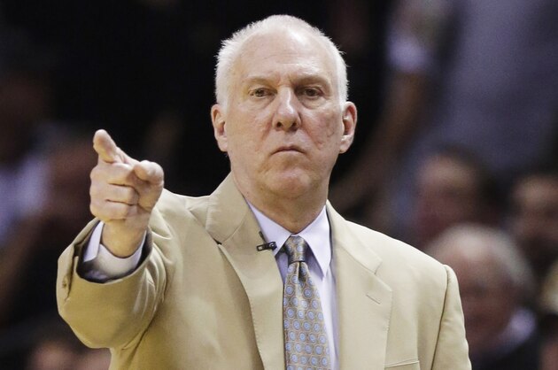 San Antonio Spurs head coach Gregg Popovich works the sideline against the Miami Heat during the first half in Game 2 of the NBA basketball finals on Sunday, June 8, 2014, in San Antonio. (AP Photo/Eric Gay)