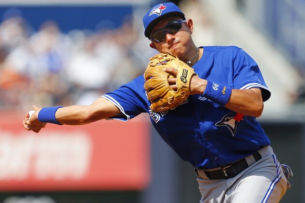 NEW YORK, NY - JULY 27: Second baseman Munenori Kawasaki #66 of the Toronto Blue Jays throws out Brendan Ryan #17 of the New York Yankees in the seventh inning during a MLB baseball game at Yankee Stadium on July 27, 2014 in the Bronx borough of New York City. The Blue Jays defeated the Yankees 5-4. (Photo by Rich Schultz/Getty Images) NEW YORK, NY - JULY 27: Second baseman Munenori Kawasaki #66 of the Toronto Blue Jays throws out Brendan Ryan #17 of the New York Yankees in the seventh inning during a MLB baseball game at Yankee Stadium on July 27, 2014 in the Bronx borough of New York City. The Blue Jays defeated the Yankees 5-4. (Photo by Rich Schultz/Getty Images)