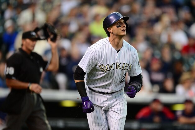 Jul 11, 2014; Denver, CO, USA; Colorado Rockies shortstop Troy Tulowitzki (2) runs after a two run home run in the third inning against the Minnesota Twins at Coors Field. Mandatory Credit: Ron Chenoy-USA TODAY Sports
