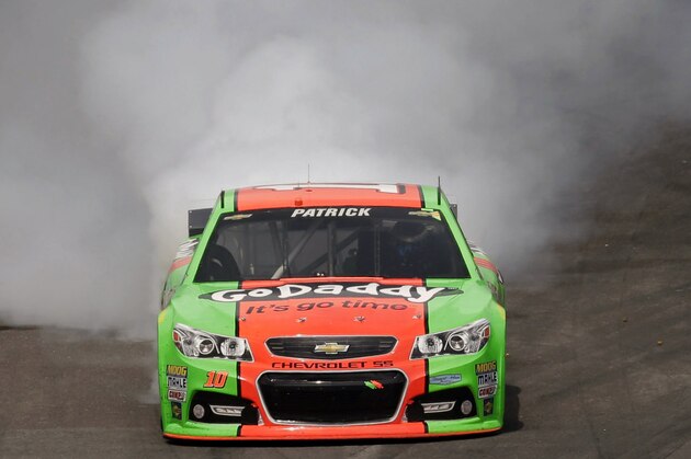 Danica Patrick has a mechanical failure while leaving a pit stop during the Brickyard 400 auto race at Indianapolis Motor Speedway in Indianapolis, Sunday, July 27, 2014. (AP Photo/AJ Mast)