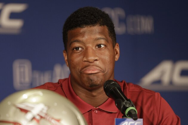 Florida State's Jameis Winston answers a question during a news conference at the Atlantic Coast Conference Football kickoff in Greensboro, N.C., Sunday, July 20, 2014. (AP Photo/Chuck Burton)