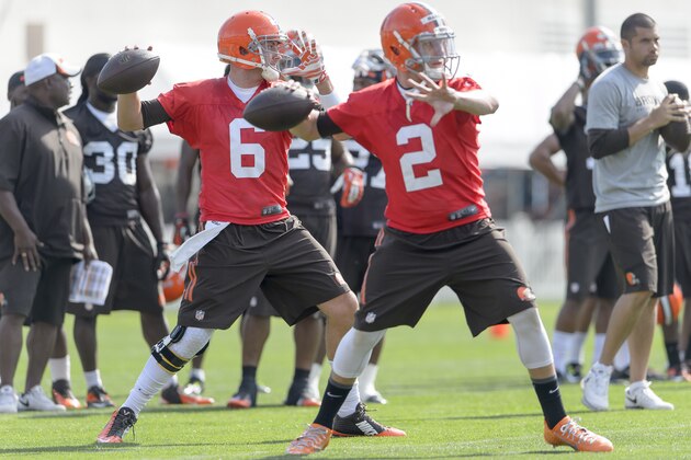 BEREA, OH - JULY 26: Quarterbacks Brian Hoyer #6 and quarterback Johnny Manziel #2 of the Cleveland Browns practice a play during training camp at the Cleveland Browns training facility on July 26, 2014 in Berea, Ohio. (Photo by Jason Miller/Getty Images)