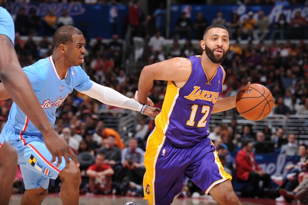 LOS ANGELES, CA - APRIL 6: Kendall Marshall #12 of the Los Angeles Lakers dribbles against Chris Paul #3 of the Los Angeles Clippers at Staples Center on April 6, 2014 in Los Angeles, California. NOTE TO USER: User expressly acknowledges and agrees that, by downloading and/or using this Photograph, user is consenting to the terms and conditions of the Getty Images License Agreement. Mandatory Copyright Notice: Copyright 2014 NBAE (Photo by Andrew D. Bernstein/NBAE via Getty Images)