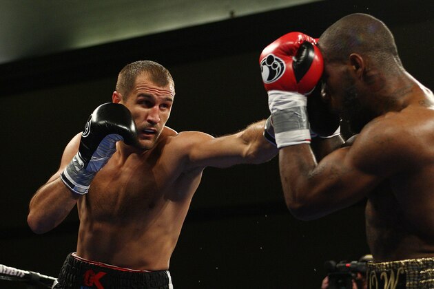 Sergey Kovalev, left, of Russia punches Cedric Agnew of Chicago, IL during the first round of WBO Light Heavyweight Championship boxing in Atlantic City, N.J. on Saturday, March 29, 2014. Kovalev won by knockout in the seventh round. (AP Photo/Tim Larsen)