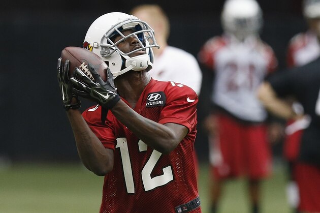 Arizona Cardinals' John Brown makes a catch during the first day of NFL football training camp on Saturday, July 26, 2014, in Glendale, Ariz. (AP Photo/Ross D. Franklin)