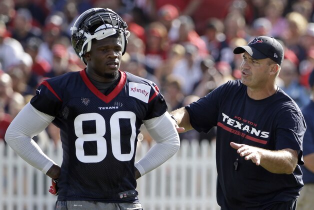 Houston Texans coach Bill O’Brien, right, talks to wide receiver Andre Johnson (80) during an NFL football training camp practice Sunday, July 27, 2014, in Houston. (AP Photo/David J. Phillip)
