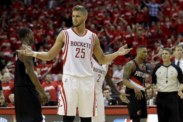 Houston Rockets' Chandler Parsons (25) reacts after Portland Trail Blazers' Robin Lopez hit him on the shoulder after fouling out during overtime in Game 1 of an opening-round NBA basketball playoff series Sunday, April 20, 2014, in Houston. The Trail Blazers won 122-120 in overtime. (AP Photo/David J. Phillip)