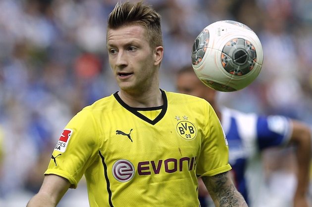 Dortmund's Marco Reus plays the ball during the German Bundesliga soccer match between Hertha BSC Berlin and Borussia Dortmund in Berlin, Germany, Saturday, May 10, 2014. Dortmund defeated Hertha by 4-0. (AP Photo/Michael Sohn)