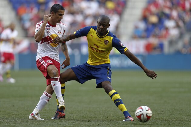 HARRISON, NJ - JULY 26:  About Diaby #24 of Arsenal fights for the ball with Tim Cahill #17 of New York Red Bulls during their friendly match at Red Bull Arena on July 26, 2014 in Harrison, NJ. (Photo by Jeff Zelevansky/Getty Images)