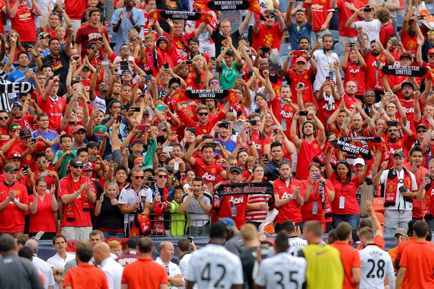 DENVER, CO - JULY 26: Fans of Manchester United support their team as they walk off the field after an International Champions Cup match against AS Roma at Sports Authority Field at Mile High on July 26, 2014 in Denver, Colorado. Manchester United defeated AS Roma 3-2. (Photo by Justin Edmonds/Getty Images)