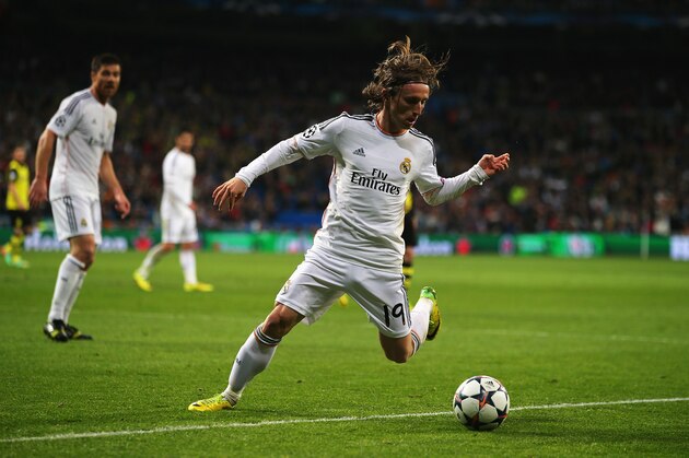 MADRID, SPAIN - APRIL 02: Luka Modric of Real Madrid in action during the UEFA Champions League Quarter Final first leg match between Real Madrid and Borussia Dortmund at Estadio Santiago Bernabeu on April 2, 2014 in Madrid, Spain.  (Photo by Clive Rose/Getty Images)