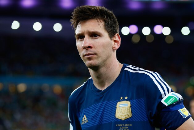 RIO DE JANEIRO, BRAZIL - JULY 13:  Lionel Messi of Argentina looks on  after being defeated by Germany 1-0 during the 2014 FIFA World Cup Brazil Final match between Germany and Argentina at Maracana on July 13, 2014 in Rio de Janeiro, Brazil.  (Photo by Clive Rose/Getty Images)