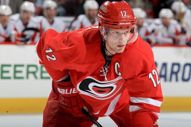 RALEIGH, NC - APRIL 10: Eric Staal #12 of the Carolina Hurricanes prepares for a faceoff during their NHL game against the Washington Capitals at PNC Arena on April 10, 2014 in Raleigh, North Carolina. (Photo by Gregg Forwerck/NHLI via Getty Images)
