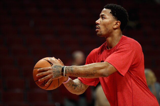 CHICAGO, IL - FEBRUARY 11:  Derrick Rose #1 of the Chicago Bulls, who suffered a season-ending knee injury in November, practices his shooting before the Bulls take on the Atlanta Hawks at the United Center on February 11, 2014 in Chicago, Illinois. NOTE TO USER: User expressly acknowledges and agrees that, by downloading and or using this photograph, User is consenting to the terms and conditions of the Getty Images License Agreement.  (Photo by Jonathan Daniel/Getty Images)