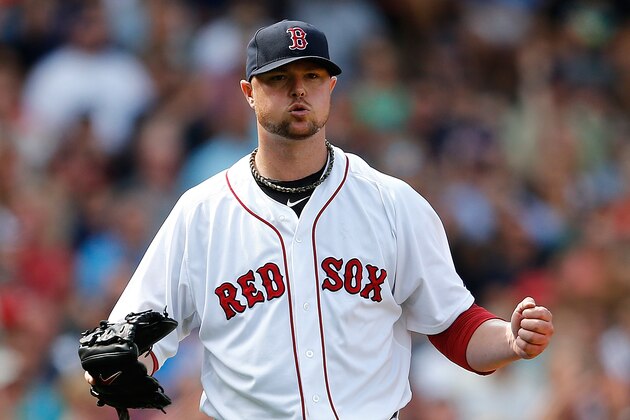 BOSTON, MA - JULY 20: Jon Lester #31 of the Boston Red Sox reacts after getting out of trouble in the sixth inning against the Kansas City Royals at Fenway Park on July 20, 2014 in Boston, Massachusetts.  (Photo by Jim Rogash/Getty Images)