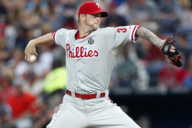 Philadelphia Phillies starting pitcher A.J. Burnett works in the first inning of a baseball game against the Atlanta Braves in Atlanta, Friday, July 18, 2014. (AP Photo/John Bazemore)