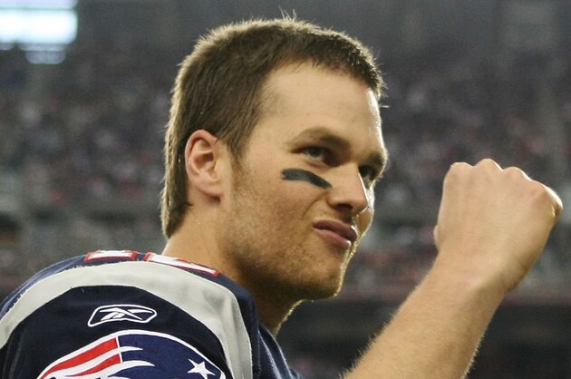 GLENDALE, AZ - FEBRUARY 03:  Quarterback Tom Brady #12 of the New England Patriots gestures to the crowd before taking on the New York Giants during Super Bowl XLII on February 3, 2008 at the University of Phoenix Stadium in Glendale, Arizona.  (Photo by Harry How/Getty Images)