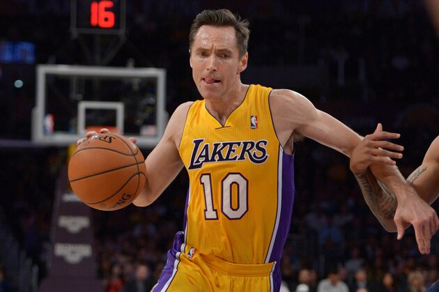 Feb 11, 2014; Los Angeles, CA, USA; Los Angeles Lakers guard Steve Nash (10) dribbles the ball against the Utah Jazz at Staples Center. Mandatory Credit: Kirby Lee-USA TODAY Sports