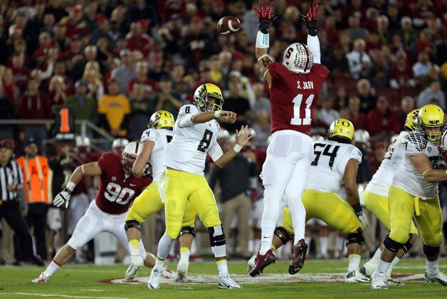 Nov 7, 2013; Stanford, CA, USA; Stanford Cardinal linebacker Shayne Skov (11) deflects the pass attempt by Oregon Ducks quarterback Marcus Mariota (8) during the first quarter at Stanford Stadium. Mandatory Credit: Kelley L Cox-USA TODAY Sports