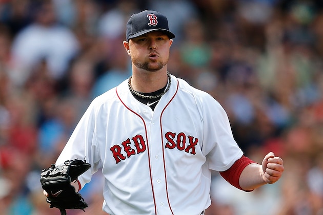 BOSTON, MA - JULY 20: Jon Lester #31 of the Boston Red Sox reacts after getting out of trouble in the sixth inning against the Kansas City Royals at Fenway Park on July 20, 2014 in Boston, Massachusetts.  (Photo by Jim Rogash/Getty Images)