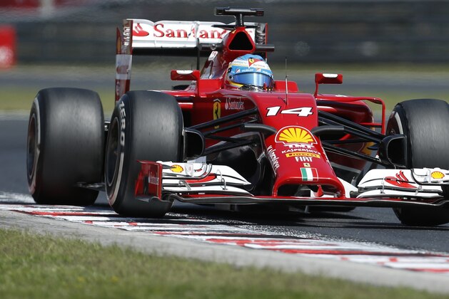 Ferrari driver Fernando Alonso of Spain steers his car during the free practice session at the Hungarian Formula One Grand Prix in Budapest, Hungary, Friday, July 25, 2014. The Hungarian Formula One Grand Prix will be held on Sunday, July, 27, 2014. (AP Photo/Darko Bandic)