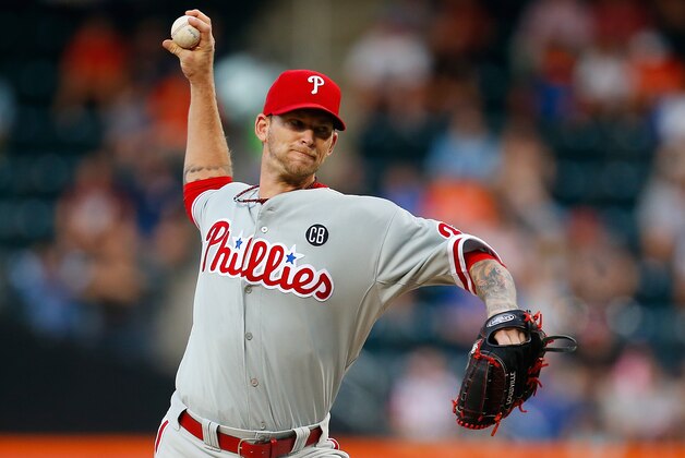 NEW YORK, NY - JULY 28:  A.J. Burnett #34 of the Philadelphia Phillies pitches in the first inning against the New York Mets on July 28, 2014 at Citi Field in the Flushing neighborhood of the Queens borough of New York City.  (Photo by Mike Stobe/Getty Images)