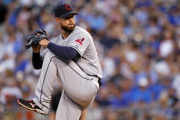 Cleveland Indians pitcher Corey Kluber throws in the fifth inning of a baseball game against the Kansas City Royals at Kauffman Stadium in Kansas City, Mo., Thursday, July 24, 2014.  (AP Photo/Colin E. Braley)