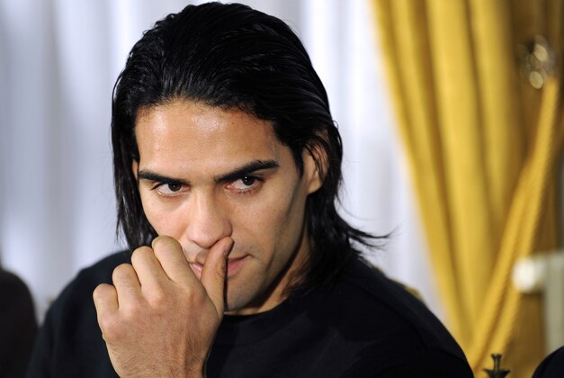 Colombian soccer star Radamel Falcao reacts as he attends a press conference at the Trindade Hospital in Porto, Portugal, Monday, Jan. 27, 2014. Colombia and Monaco's striker Falcao is in a race against time to get fit for the World Cup in June after undergoing knee surgery Saturday, Jan. 25, with his doctor giving him a better than 50-50 chance of making it. (AP Photo/Paulo Duarte)