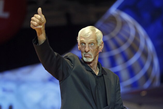 Ray Guy is introduced before the inaugural Pro Football Hall of Fame Fan Fest Friday, May 2, 2014, at the International Exposition Center in Cleveland. (AP Photo/Mark Duncan)