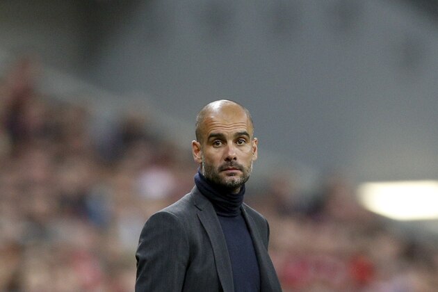 Bayern head coach Pep Guardiola of Spain watches his team during the Champions League semifinal second leg soccer match between Bayern Munich and Real Madrid at the Allianz Arena in Munich, southern Germany, Tuesday, April 29, 2014. (AP Photo/Matthias Schrader)